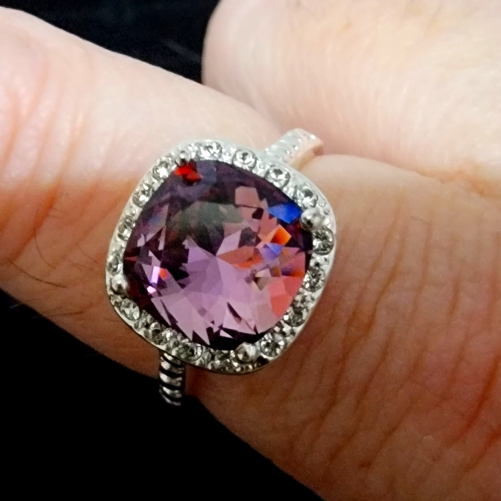 Beautiful silver colored ring with bling! Shiny square cut purple gem